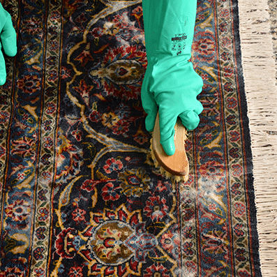 Hand-detailing an oriental area rug